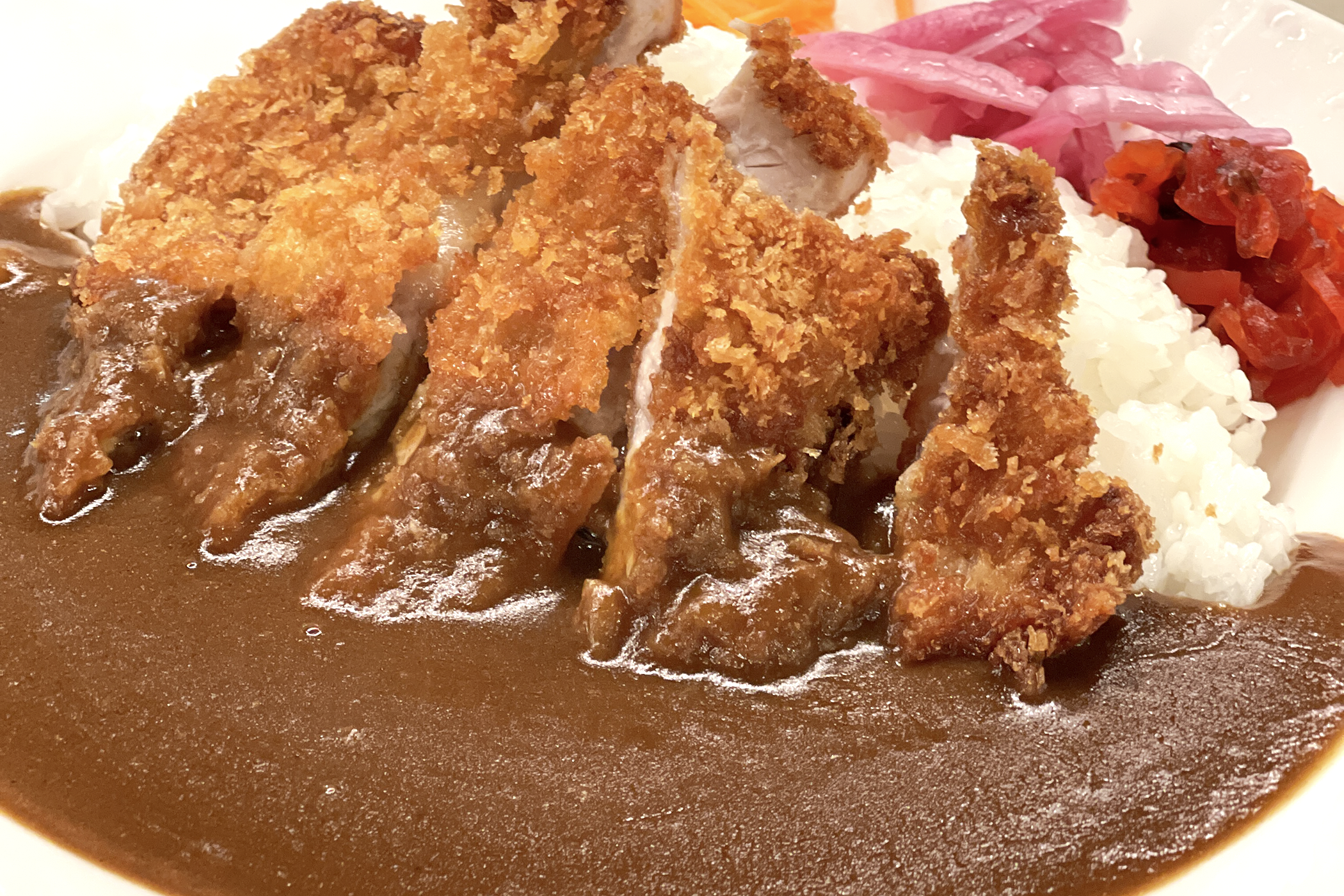 A close-up of chicken katsu curry at Ichi-ban Boshi Express, with crisp crumbed chicken and Japanese curry